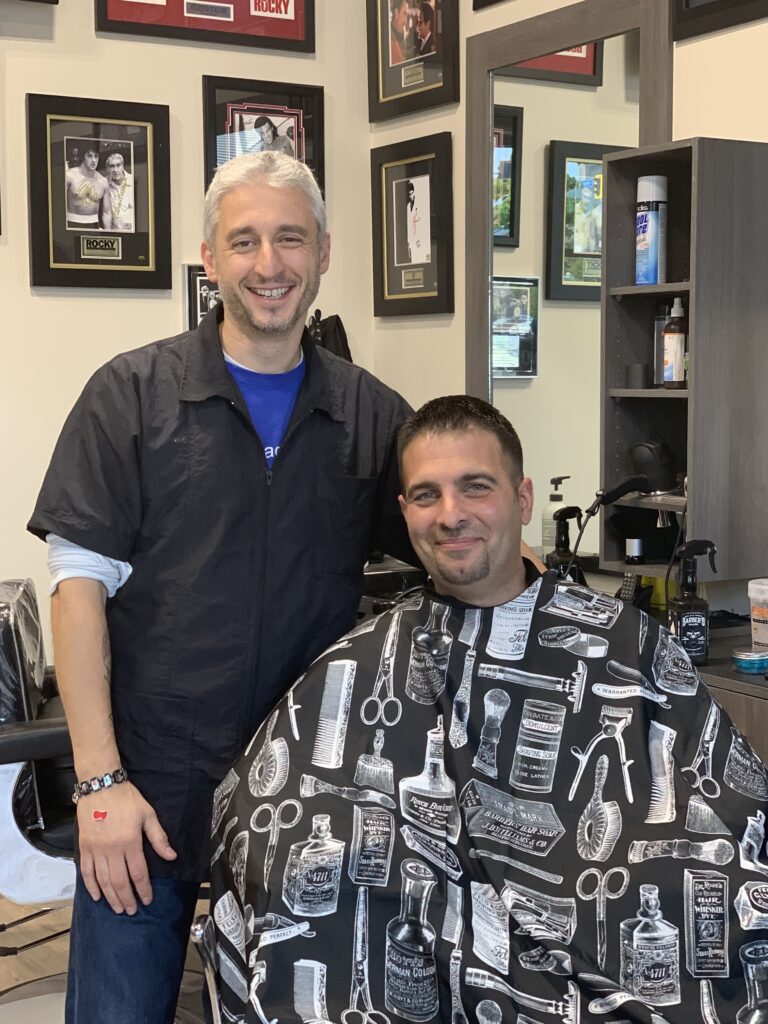 Barber with a freshly groomed client at Classe Barber Shop