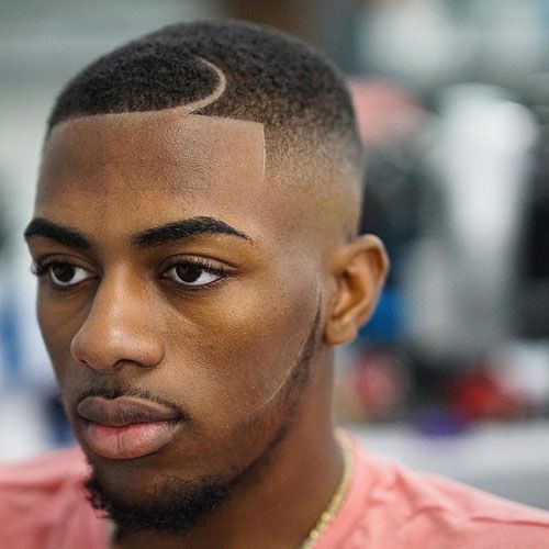 Precision skin fade with a hair design